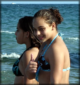 picture of a young girl smiling and giving the thumbs up at deerfield beach